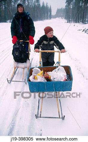 Going by kick-sledge. Mother and child. Sweden View Large Photo Image Stock Photography - Going by kick-sledge. Mother and child. Sweden. Fotosearch