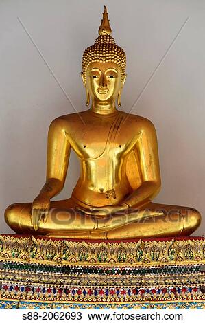 Stock Image - Golden Buddha at Wat pho temple which is one of the biggest temple in Bangkok. There are more than 1, 000 Buddha images in these temple.. Fotosearch