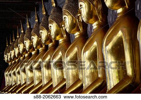 Stock Image - Golden Buddha at Wat Suthat temple in Bangkok.. Fotosearch