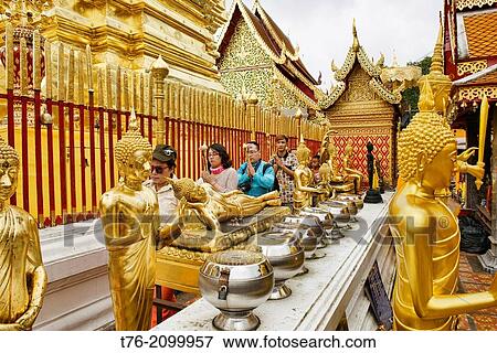 Golden Buddhas at Doi Suthep Temple above Chiang Mai, Thailand. View Large Photo Image Stock Photo - Golden Buddhas at Doi Suthep Temple above Chiang Mai, Thailand.. Fotosearch