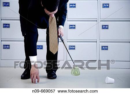 Stock Photo - Golf in office. Fotosearch