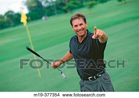 Picture - golfer after a wining shot. Fotosearch