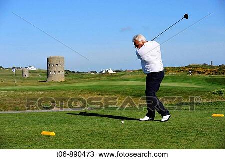 Golfer in Guernsey, Channel Islands, UK View Large Photo Image Stock Image - Golfer in Guernsey, Channel Islands, UK. Fotosearch