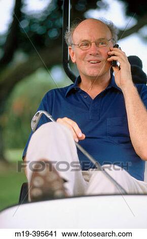 golfer talking on a cell phone View Large Photo Image Stock Image - golfer talking on a cell phone. Fotosearch