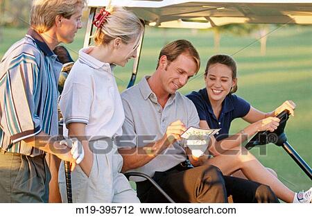 Stock Image - golfers check their score card. Fotosearch