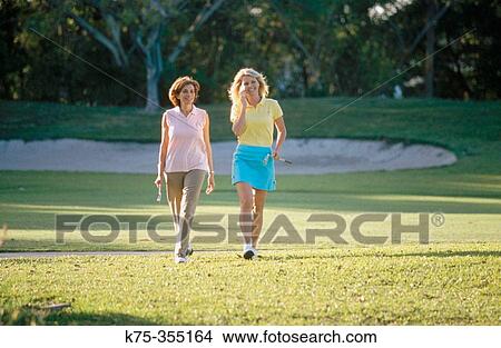 Golfing mother and daughter View Large Photo Image Picture - Golfing mother and daughter. Fotosearch