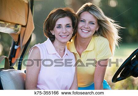 Golfing mother and daughter View Large Photo Image Stock Photograph - Golfing mother and daughter. Fotosearch