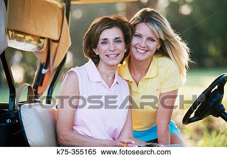 Golfing mother and daughter View Large Photo Image Stock Photography - Golfing mother and daughter. Fotosearch