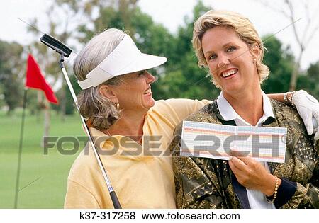 Golfing women showing their score cards View Large Photo Image Stock Photo - Golfing women showing their score cards. Fotosearch