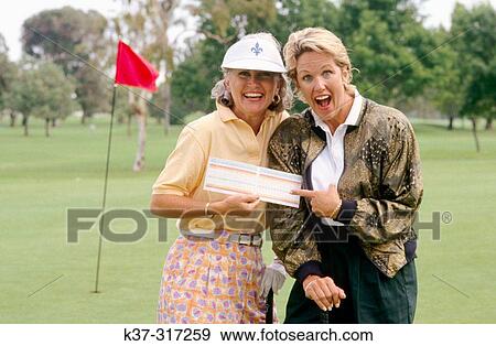 Golfing women showing their score cards View Large Photo Image Stock Photo - Golfing women showing their score cards. Fotosearch