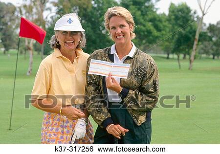 Golfing women showing their score cards View Large Photo Image Stock Photograph - Golfing women showing their score cards. Fotosearch