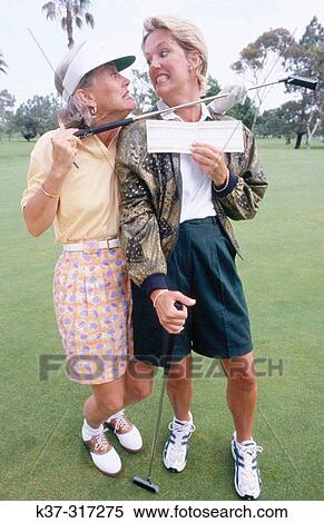 Golfing women showing their score cards View Large Photo Image Stock Photography - Golfing women showing their score cards. Fotosearch