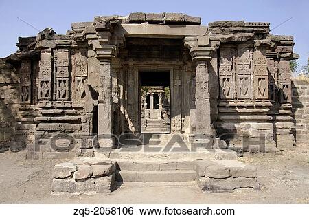 Gondeshwar Temple, carved entrance. Sinnar, Maharashtra, India It is built on a vast area and consists of numerous shrines built in an architectural style called Hemadpanthi style. Black stone and lime temple. View Large Photo Image Stock Photograph - Gondeshwar Temple, carved entrance. Sinnar, Maharashtra, India It is built on a vast area and consists of numerous shrines built in an architectural style called Hemadpanthi style. Black stone and lime temple.. Fotosearch