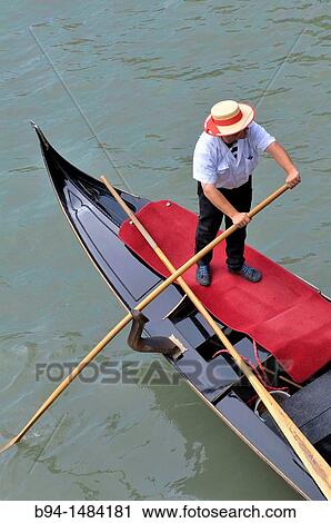 Gondola and gondolier in the Grand Canal, Venice, Veneto, Italy View Large Photo Image Stock Image - Gondola and gondolier in the Grand Canal, Venice, Veneto, Italy. Fotosearch