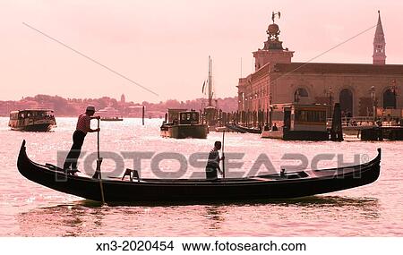 Gondola and gondolier, Venetian Lagoon, Venice, Veneto, Italy, Europe. View Large Photo Image Picture - Gondola and gondolier, Venetian Lagoon, Venice, Veneto, Italy, Europe.. Fotosearch
