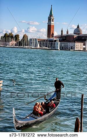 Stock Image - Gondola, Campanili and cathedral, San Giorgio Maggiore Island, Venice, Veneto, Italy. Fotosearch