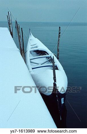 Gondola moored at Burano island after a unusual snowfall in the Venice lagoon, Venice, Italy, Europe View Large Photo Image Stock Photo - Gondola moored at Burano island after a unusual snowfall in the Venice lagoon, Venice, Italy, Europe. Fotosearch