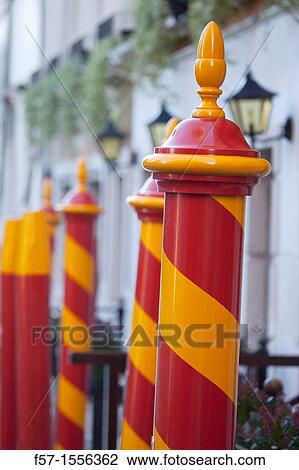 Stock Image - Gondola mooring poles in Venice, Italy. Fotosearch