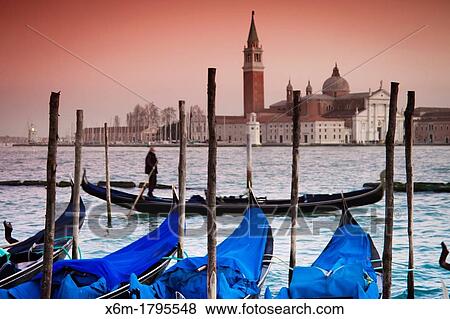 Stock Photo - Gondolas and San Giorgio Maggiore Island St Mark's Square Venice, Italy. Fotosearch