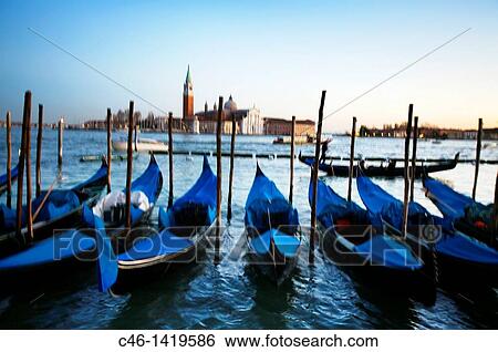 Gondolas and San Giorgio Maggiore church in background Venice Veneto, Italy View Large Photo Image Stock Photograph - Gondolas and San Giorgio Maggiore church in background Venice Veneto, Italy. Fotosearch