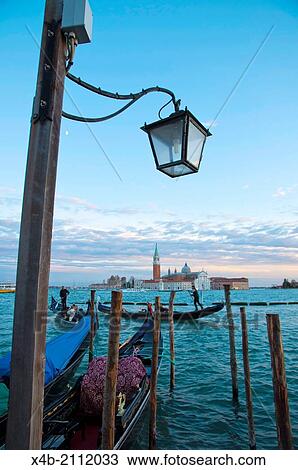 Gondolas in front of Piazza San Marco the St Mark's Square wth San Giorgio Maggiore in background Venice the Veneto Italy Europe. View Large Photo Image Stock Image - Gondolas in front of Piazza San Marco the St Mark's Square wth San Giorgio Maggiore in background Venice the Veneto Italy Europe.. Fotosearch