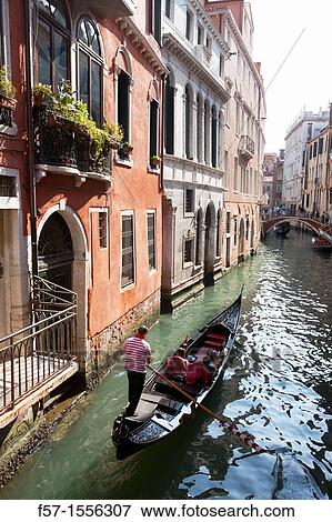 Gondolas on the narrow canals of Venice, Italy View Large Photo Image Stock Photo - Gondolas on the narrow canals of Venice, Italy. Fotosearch