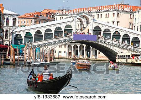 Gondolier and Rialto Bridge, Buildings Promenade, Grand Canal, Venice, Veneto Region, Italy View Large Photo Image Stock Photo - Gondolier and Rialto Bridge, Buildings Promenade, Grand Canal, Venice, Veneto Region, Italy. Fotosearch