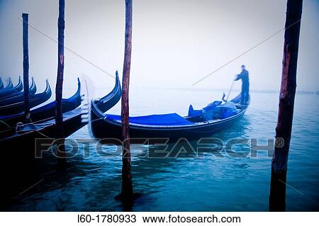 Stock Image - Gondolier in Venice, Veneto, Italy. Fotosearch