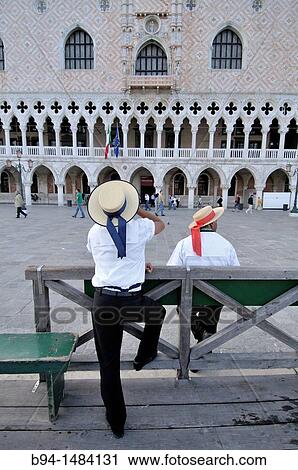 Gondoliers on Riva degli Schiavoni in front of the Doge's Palace, Venice, Veneto, Italy View Large Photo Image Stock Image - Gondoliers on Riva degli Schiavoni in front of the Doge's Palace, Venice, Veneto, Italy. Fotosearch