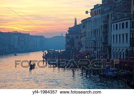 gondoliers on the grand Canal evening time with the red sky of the sunset at Venice Italy. View Large Photo Image Stock Photo - gondoliers on the grand Canal evening time with the red sky of the sunset at Venice Italy.. Fotosearch