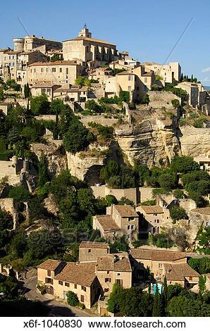 Gordes with the Ch? teau de Gordes and the Saint-Firmin church on the Monts de Vaucluse hill, Provence, France View Large Photo Image Stock Image - Gordes with the Ch? teau de Gordes and the Saint-Firmin church on the Monts de Vaucluse hill, Provence, France. Fotosearch
