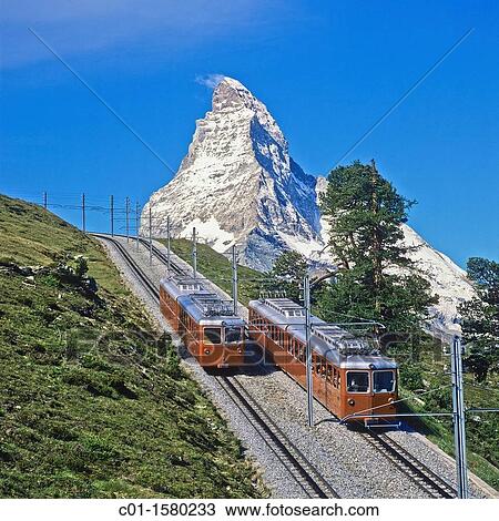 Gornergratbahn rack railway train and the Matterhorn, Zermatt, canton Valais, Switzerland View Large Photo Image Stock Image - Gornergratbahn rack railway train and the Matterhorn, Zermatt, canton Valais, Switzerland. Fotosearch
