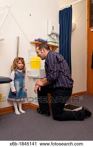 GP Doctor surgery patient consultation Child height measurement View Large Photo Image Stock Image - GP Doctor surgery patient consultation Child height measurement. Fotosearch