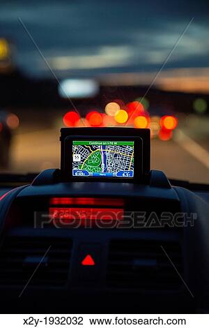 GPS unit in the window of a car in traffic. View Large Photo Image Stock Image - GPS unit in the window of a car in traffic.. Fotosearch