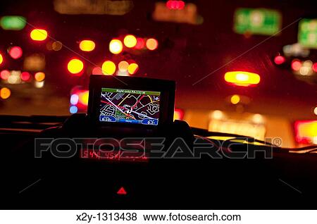 GPS unit in the window of a car in traffic View Large Photo Image Stock Photo - GPS unit in the window of a car in traffic. Fotosearch