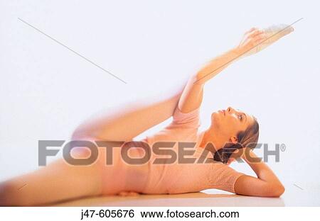 Stock Photograph - Graceful female stretching. Fotosearch
