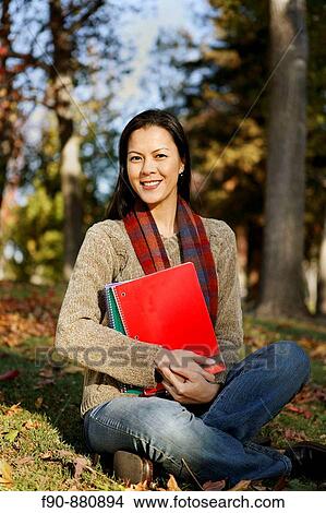 Graduate student w autumn leaves MR View Large Photo Image Picture - Graduate student w autumn leaves MR. Fotosearch