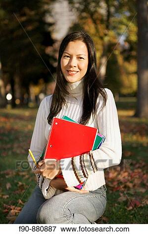 Graduate student w autumn leaves MR View Large Photo Image Stock Photo - Graduate student w autumn leaves MR. Fotosearch