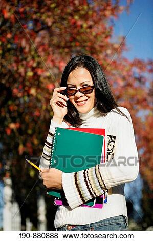 Graduate student w autumn leaves MR View Large Photo Image Stock Photo - Graduate student w autumn leaves MR. Fotosearch