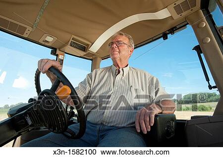 Grain producer operating tractor planting soybeans, Montgomery County Maryland USA View Large Photo Image Stock Image - Grain producer operating tractor planting soybeans, Montgomery County Maryland USA. Fotosearch