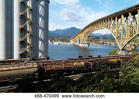 Stock Photo - Grain terminal and Second Narrows Bridge, Vancouver, BC, Canada. Fotosearch