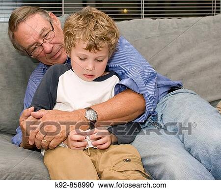 Grandfather and crying child View Large Photo Image Stock Image - Grandfather and crying child. Fotosearch