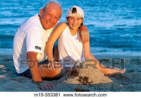 Grandfather and Grandaughter at the beach View Large Photo Image Stock Image - Grandfather and Grandaughter at the beach. Fotosearch