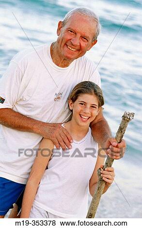 Grandfather and Grandaughter at the beach View Large Photo Image Stock Photo - Grandfather and Grandaughter at the beach. Fotosearch