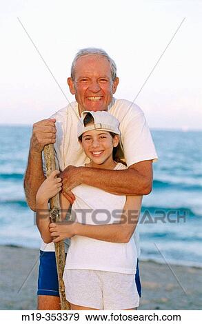 Grandfather and Grandaughter at the beach View Large Photo Image Stock Photo - Grandfather and Grandaughter at the beach. Fotosearch