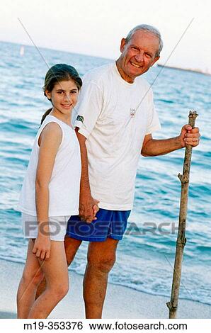 Grandfather and Grandaughter at the beach View Large Photo Image Stock Photograph - Grandfather and Grandaughter at the beach. Fotosearch