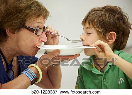 Grandma and grandson eating from the same dish, tasting session in sensory analysis lab, AZTI-Tecnalia Marine and Food Research Center, Derio, Bizkaia, Euskadi, Spain View Large Photo Image Stock Photo - Grandma and grandson eating from the same dish, tasting session in sensory analysis lab, AZTI-Tecnalia Marine and Food Research Center, Derio, Bizkaia, Euskadi, Spain. Fotosearch