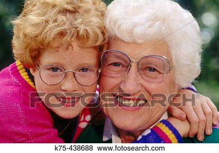Stock Photo - Grandma gets a big hug. Fotosearch
