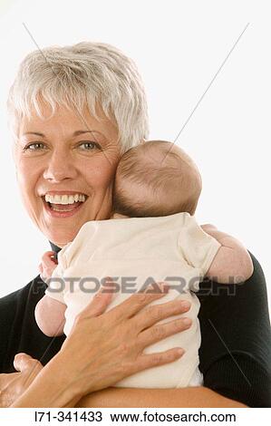 Stock Image - Grandmother and baby. Fotosearch