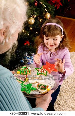 Grandmother and child with Christmas cookies. View Large Photo Image Stock Image - Grandmother and child with Christmas cookies.. Fotosearch